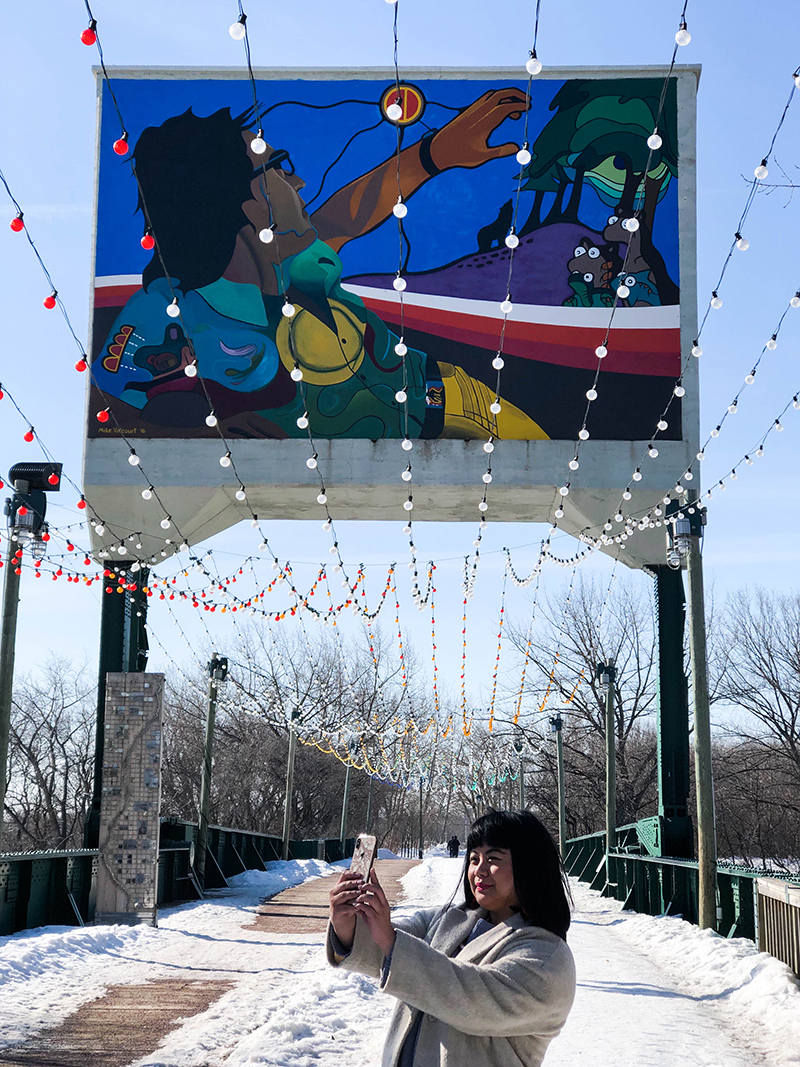 woman-taking-selfie-phone-photo-train-bridge-mural-lights.jpg (903 KB)